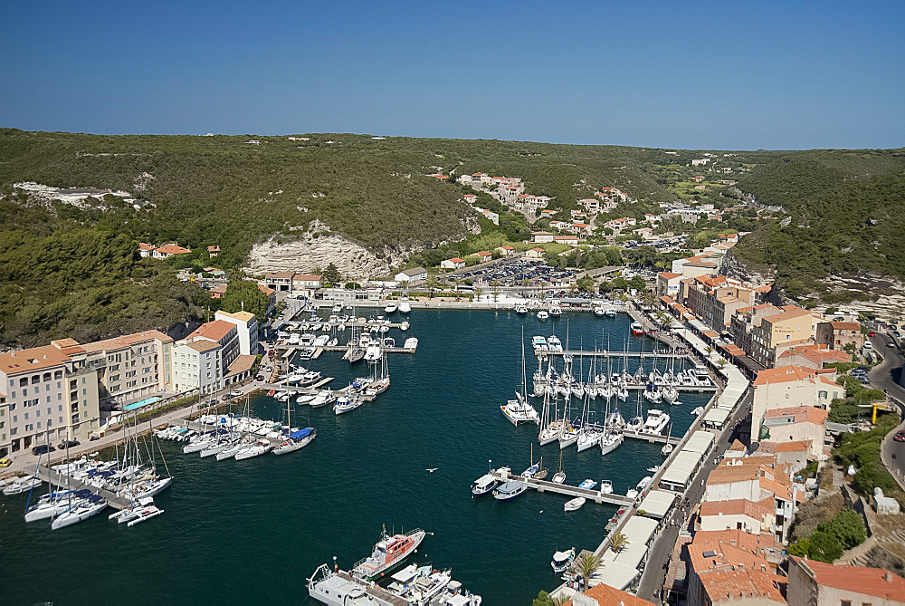 An aerial view of the harbour and rooftops in Bonifacio, Corsica, France, Mediterranean, Europe