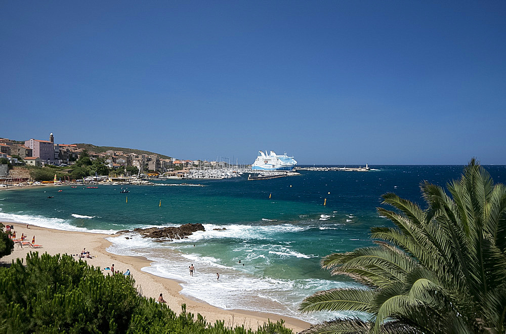 A view over the beach to the town of Propriano on the southwest coast of Corsica, France, Mediterranean, Europe