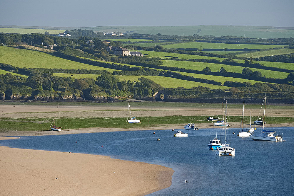 Rolling hills and yachts moored in the Camel Estuary near Padstow, Cornwall, England, United Kingdom, Europe