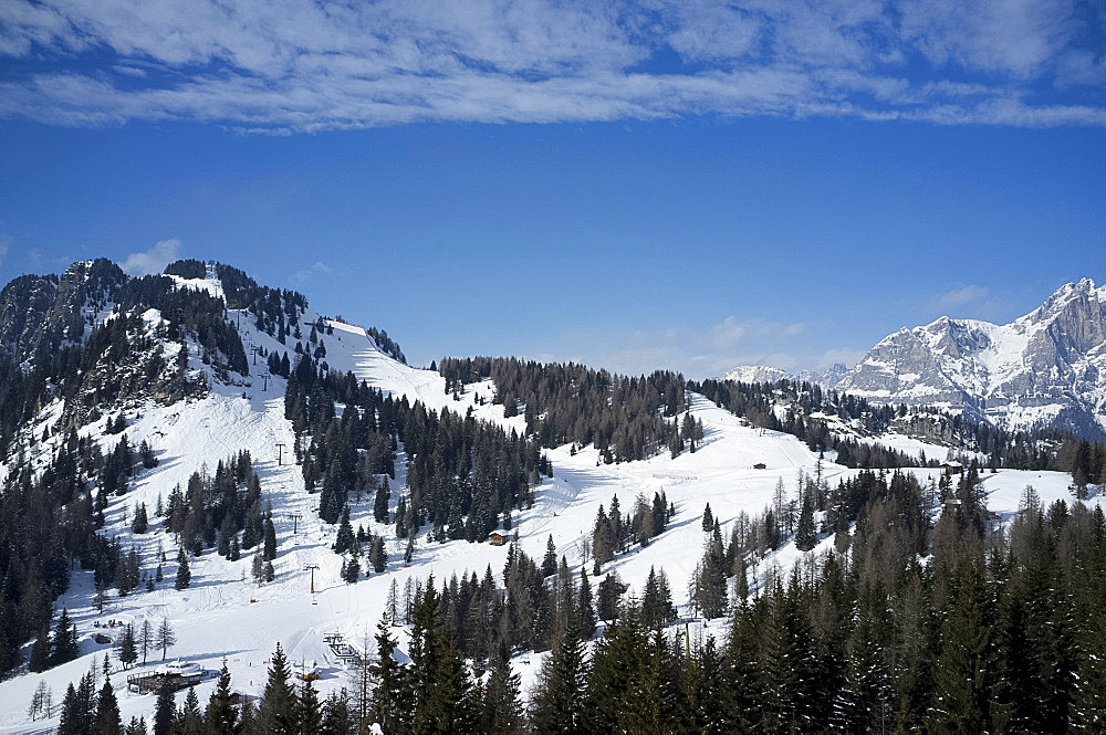 An aerial view of The Civetta ski resort and Civetta Mountain in the distance, The Dolomites, South Tyrol, Italy, Europe