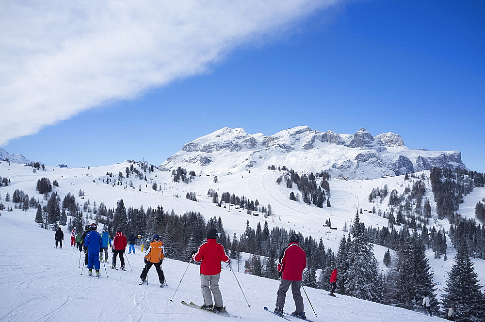 A group of skiers at the Alta Badia ski resort near Corvara, Dolomites, South Tyrol, Italy, Europe