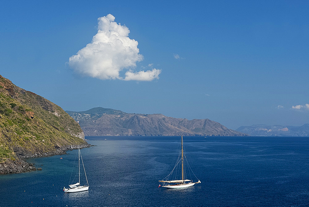 Rocky cliffs rising from the sea near Pollara on the island of Salina, The Aeolian Islands, UNESCO World Heritage Site, off Sicily, Messina Province, Italy, Mediterranean, Europe