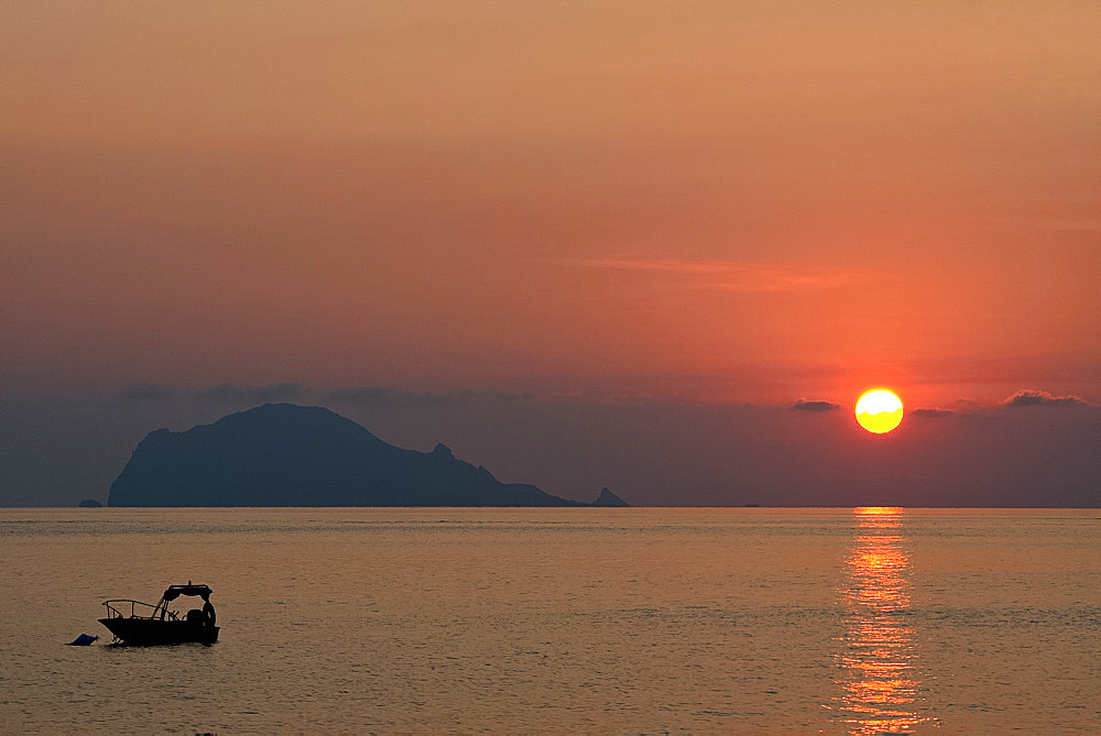 A view to Filicudi Island from Salina Island at sunrise in The Aeolian Islands, UNESCO World Heritage Site, off Sicily, Messina Province, Italy, Mediterranean, Europe