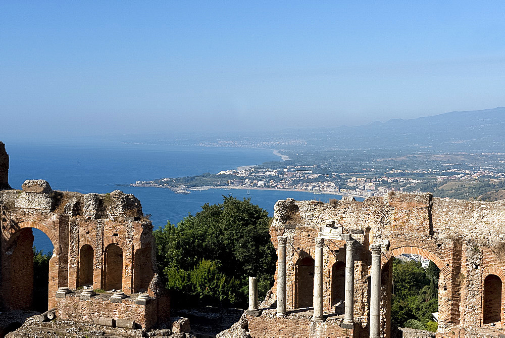 A view of the Greek Theatre and Naxos Bay on the Ionian Sea from Taormina, Sicily, Italy, Mediterranean, Europe