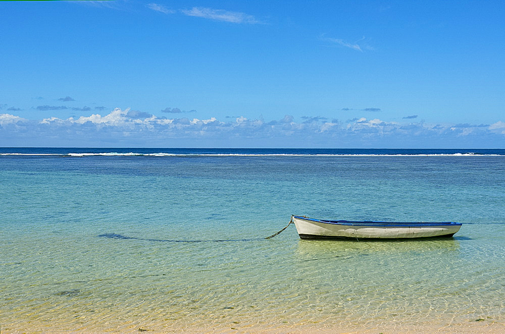 An old wooden boat moored inside the reef, Mauritius, Indian Ocean, Africa