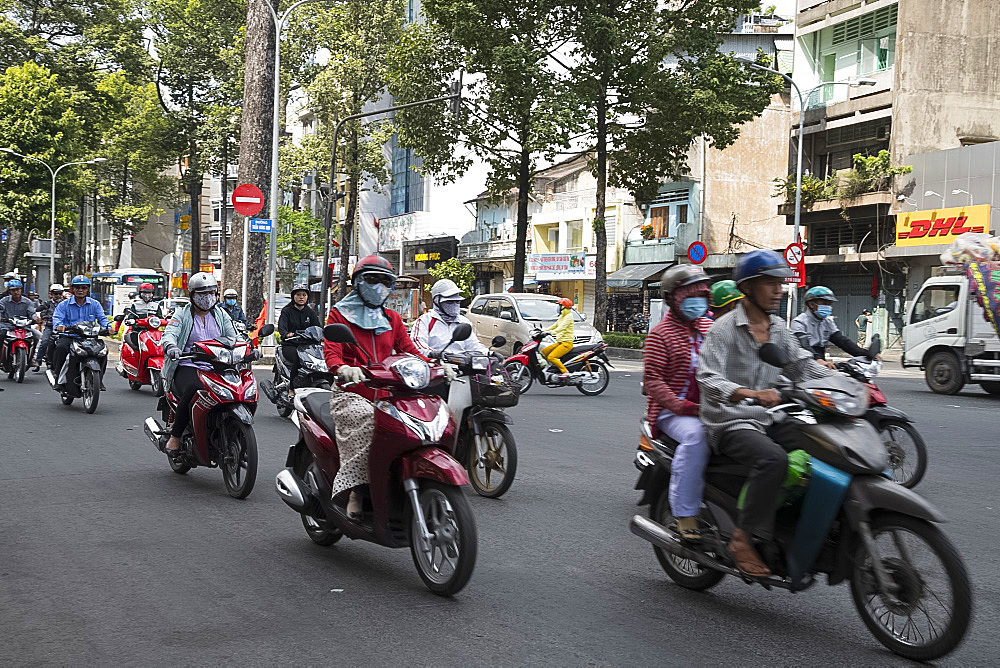 Motorcyclists on a busy street in Ho Chi MInh City, Vietnam, Indochina, Southeast Asia, Asia