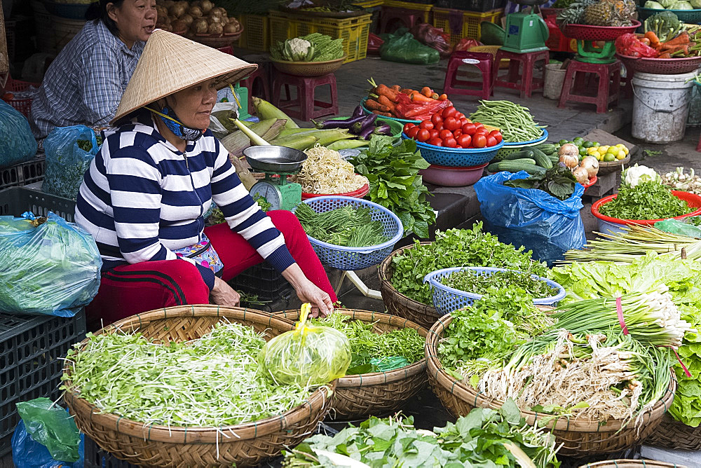 A woman selling vegetables at the market in Hoi An, Quang Nam Province, Vietnam, Indochina, Southeast Asia, Asia