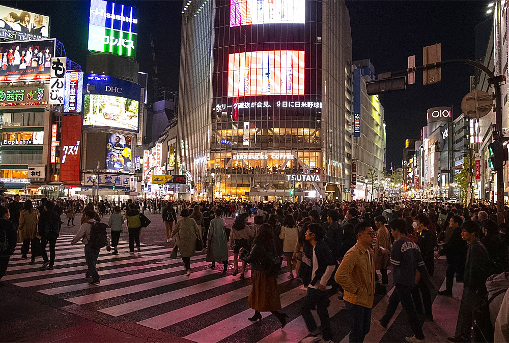 Neon signs above crowds at the Shibuya Crossing in Tokyo, Japan, Asia