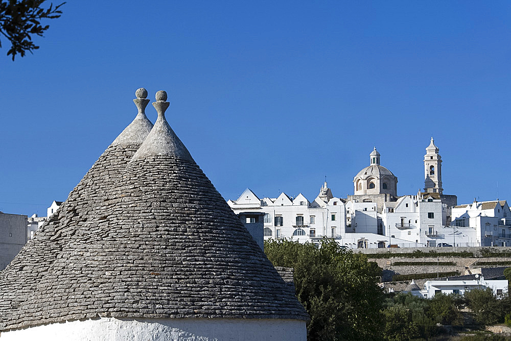 Cone shaped roofs of Trulli outside the historic center of Locorotondo, Valle d'Itria, Bari district, Puglia, Italy, Europe