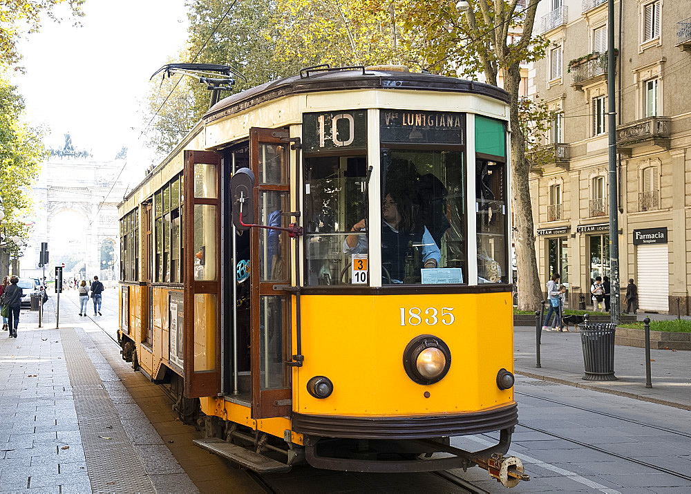 A 1920s yellow electric tram in central Milan, Lombardy, Italy, Europe