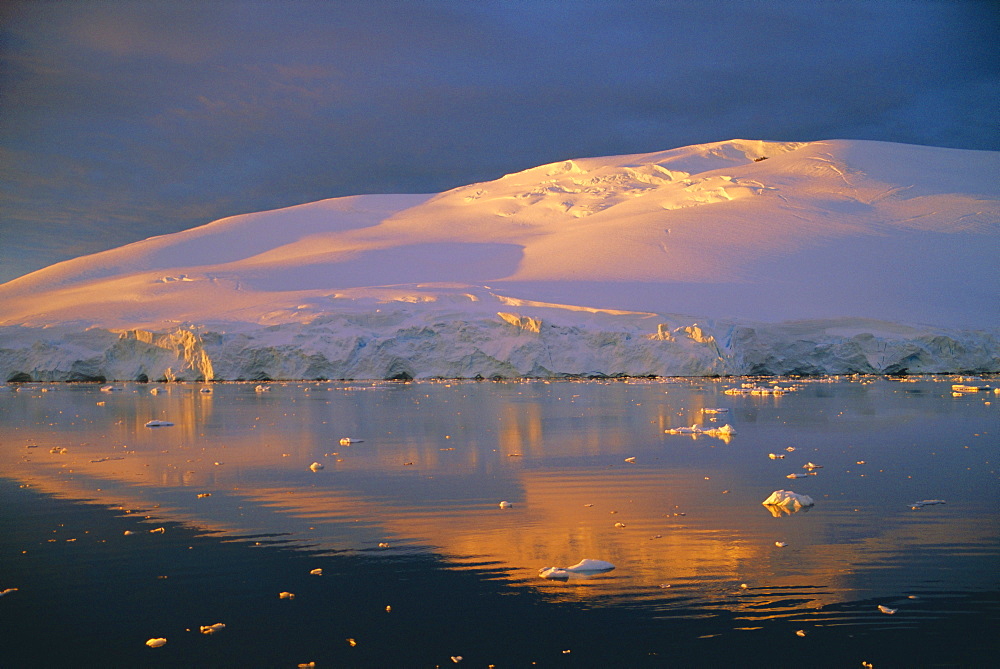 Coastal landscape lit by the midnight sun, Antarctic Peninsula, Antarctica