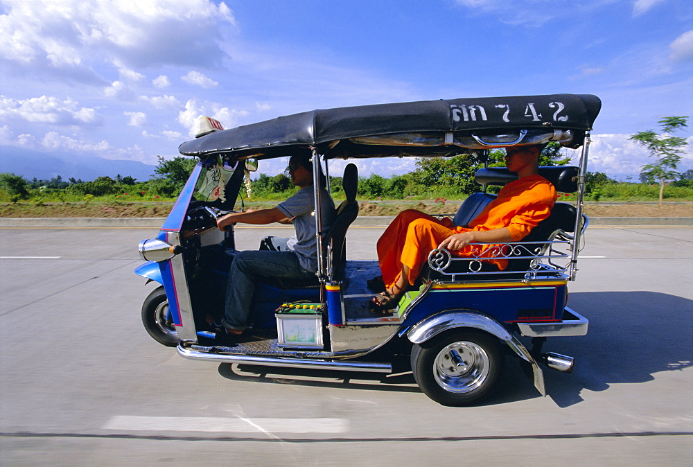 Buddhist monk in a tuk tuk taxi, Chiang Mai, northern Thailand, Asia