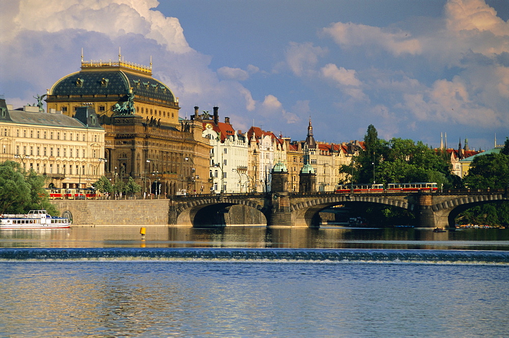 The National Theatre and houses along the Vltava River, Prague, Czech Republic, Europe