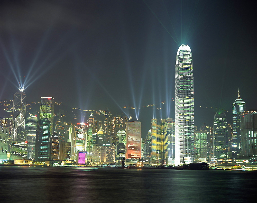 Hong Kong city skyline looking across Victoria harbour to Hong Kong Island at night, Hong Kong, China, Asia