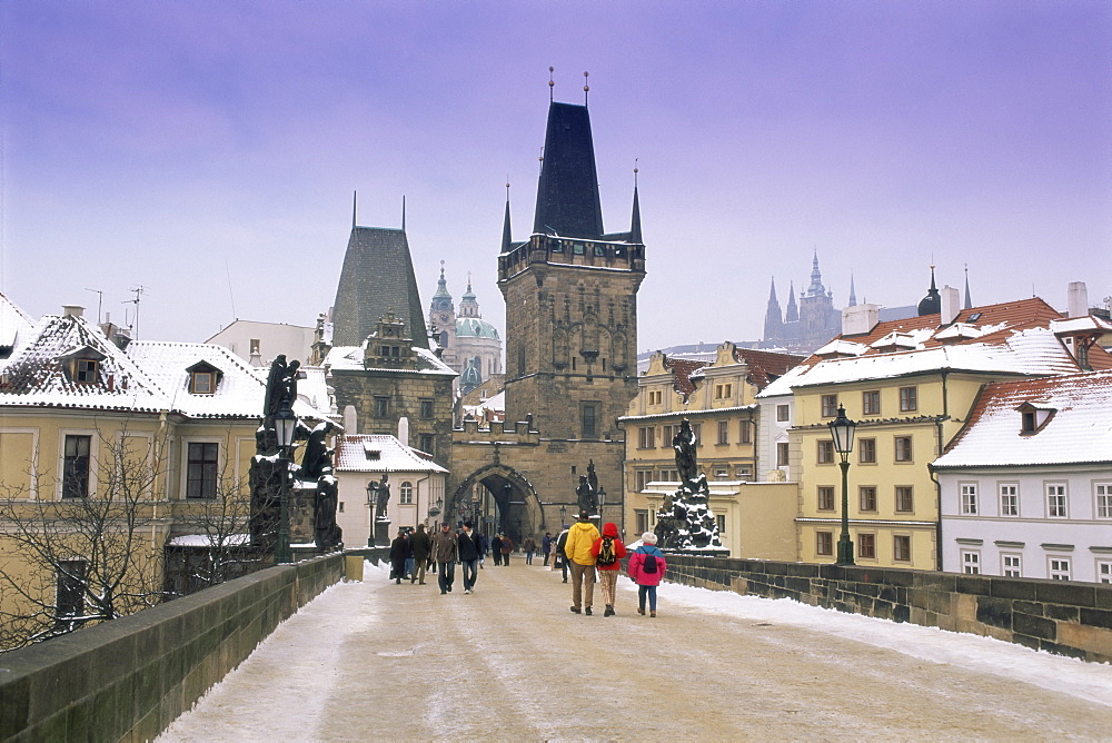 Charles Bridge and St. Vitus cathedral in winter snow, Prague, UNESCO World Heritage Site, Czech Republic, Europe