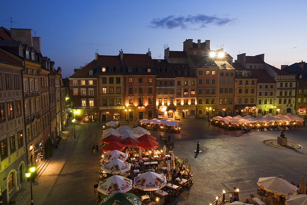 Elevated view over the square and outdoor restaurants and cafes at dusk, Old Town Square (Rynek Stare Miasto), UNESCO World Heritage Site, Warsaw, Poland, Europe