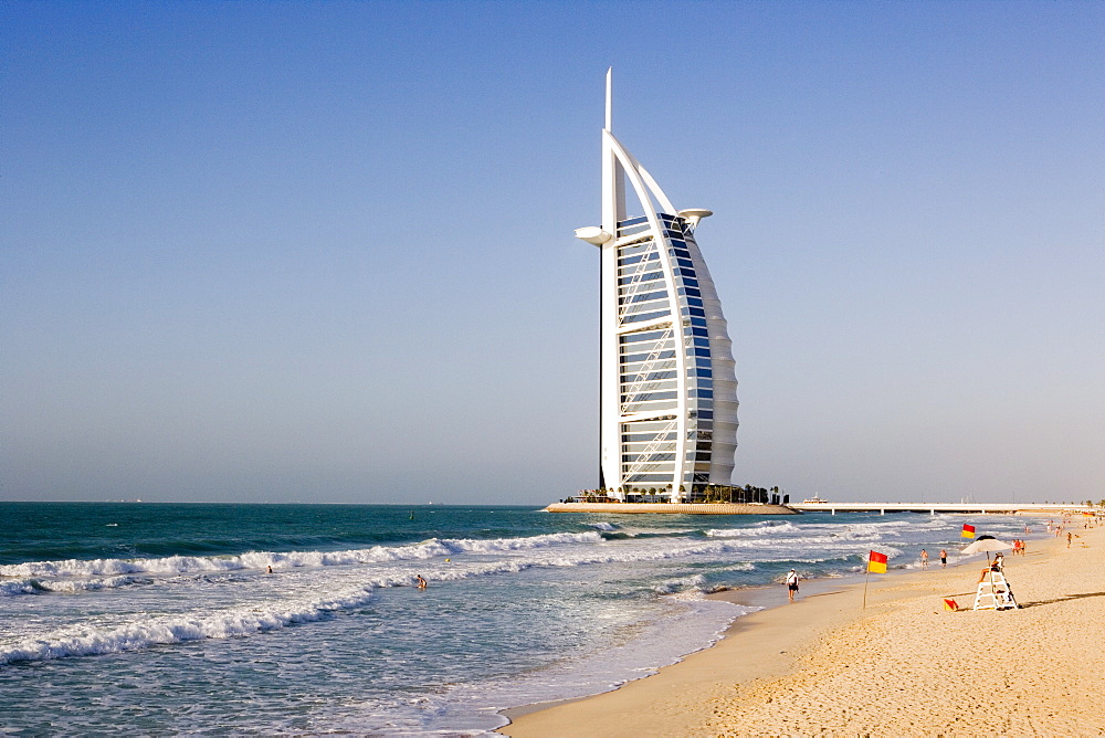 The iconic symbol of Dubai, the Burj Al Arab, the world's first seven star hotel (classified as five star deluxe), built on an artificial island offshore from the Jumeirah Beach Hotel, Dubai, United Arab Emirates, Middle East