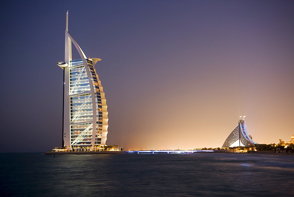 The iconic symbol of Dubai, the Burj Al Arab, the world's first seven star hotel (classified as five star deluxe), built on an artificial island offshore from the Jumeirah Beach Hotel, Dubai, United Arab Emirates, Middle East