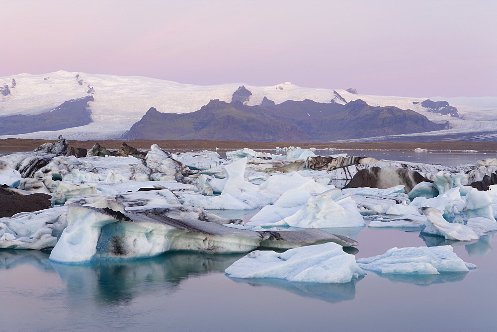 Icebergs floating in the Lagoon beneath Breidamerkurjokull Glacier, Jokulsarlon (Glacial River Lagoon), southern Vatnajokull, southern area, Iceland, Polar Regions