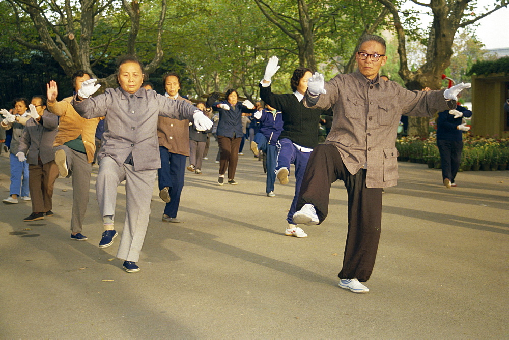 Crowd of people practicing Tai Chi, Shanghai, China, Asia