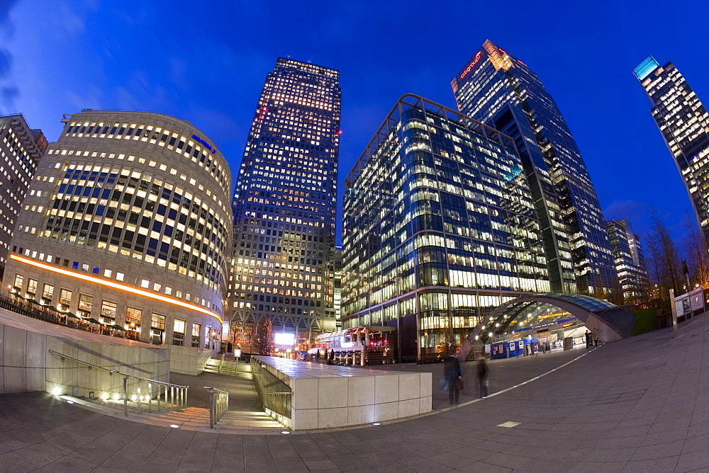 Financial District office buildings illuminated at dusk, Canary Wharf, Docklands, London, England, United Kingdom, Europe