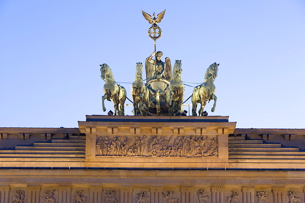 Quadriga on Brandenburger Tor (Brandenburg Gate) illuminated at dusk in Pariser Platz, Berlin, Germany, Europe