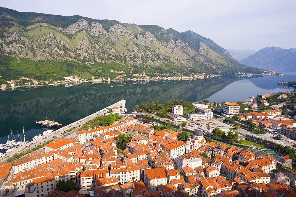 Elevated view over the Old Town, fjord and mountains from the walls of the Kotor Fortress which forms a continuous belt around the Old Town, Kotor, Bay of Kotorska, Adriatic coast, Montenegro, Europe