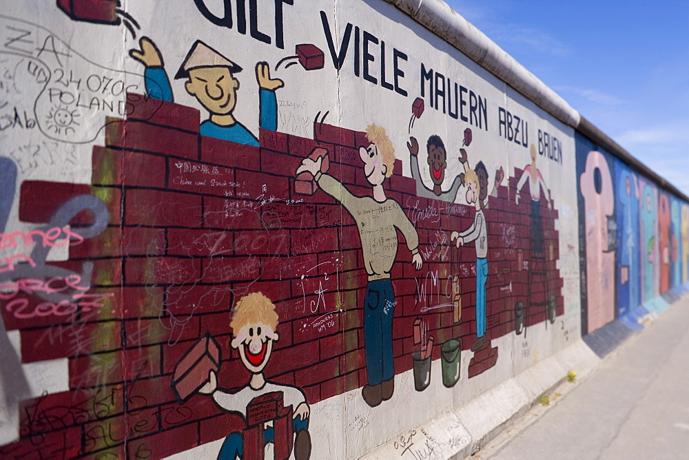 View from former East Berlin of section of Berlin Wall, called East Side Gallery because it has been painted by many international artists, Berlin, Germany, Europe