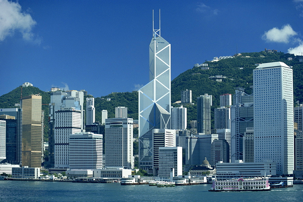 The city skyline from the harbour with the Bank of China in the centre on Hong Kong Island, China, Asia