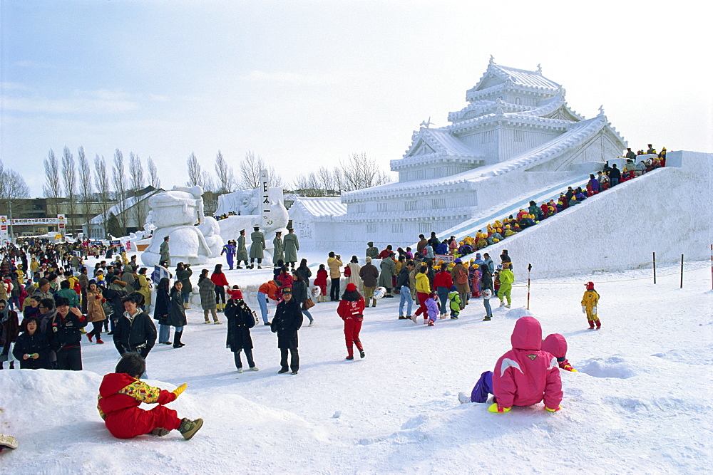 Snow sculpture and crowds during Snow Festival, Sapparo, Japan, Asia