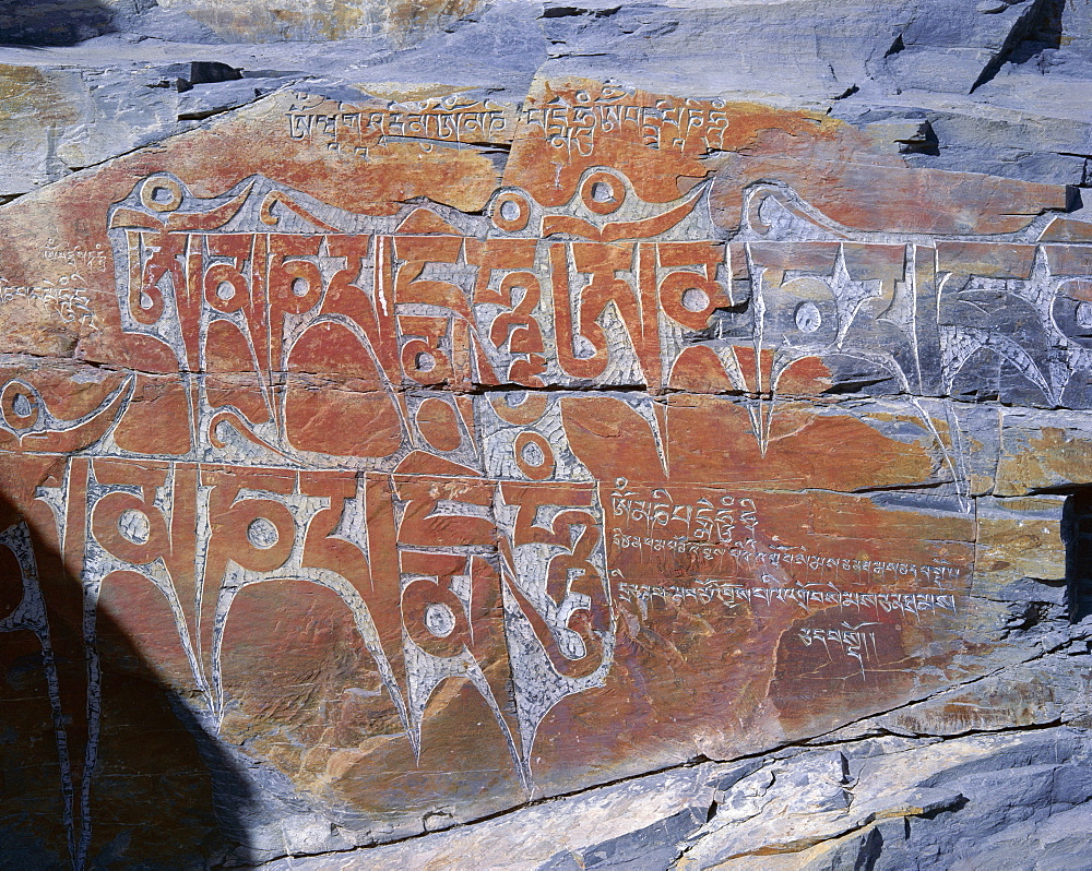 Tibetan script carved in rock face, Lhasa, Tibet, China, Asia