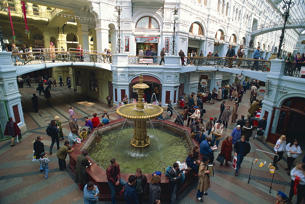 Crowds around the water fountain in the Gum department store, Moscow, Russia, Europe