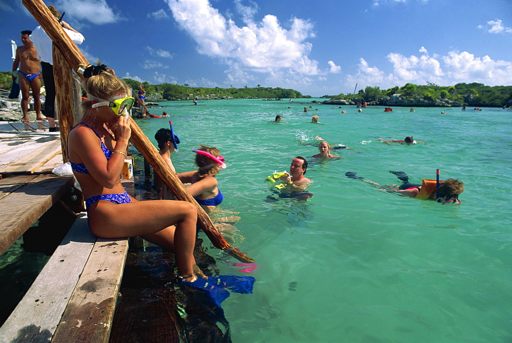 Tourists swimming and snorkelling in the Xel-Ha Lagoon National Park, Yucatan Peninsula, Mexico, North America