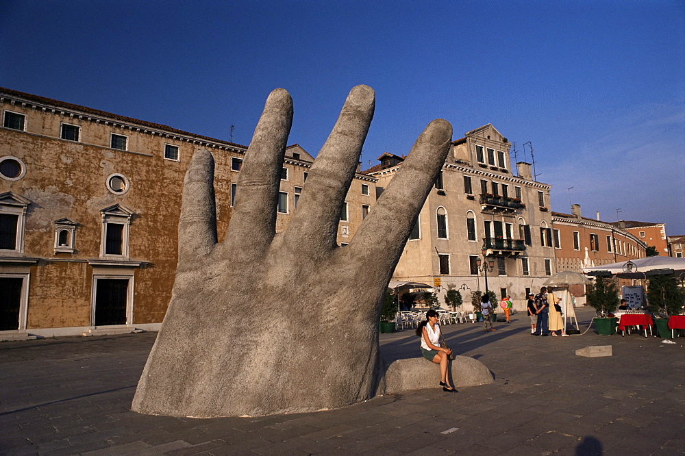 Stone sculpture of hand on Riva Degli Schiavoni, Venice, Veneto, Italy, Europe