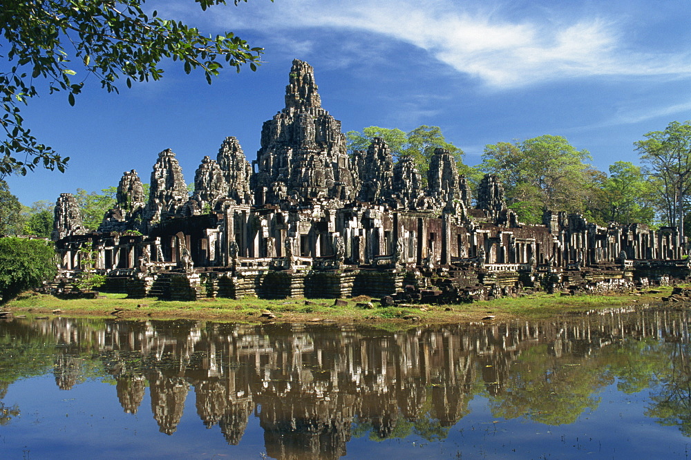 The Bayon Temple reflected in water at Angkor, UNESCO World Heritage Site, Siem Reap, Cambodia, Indochina, Southeast Asia, Asia