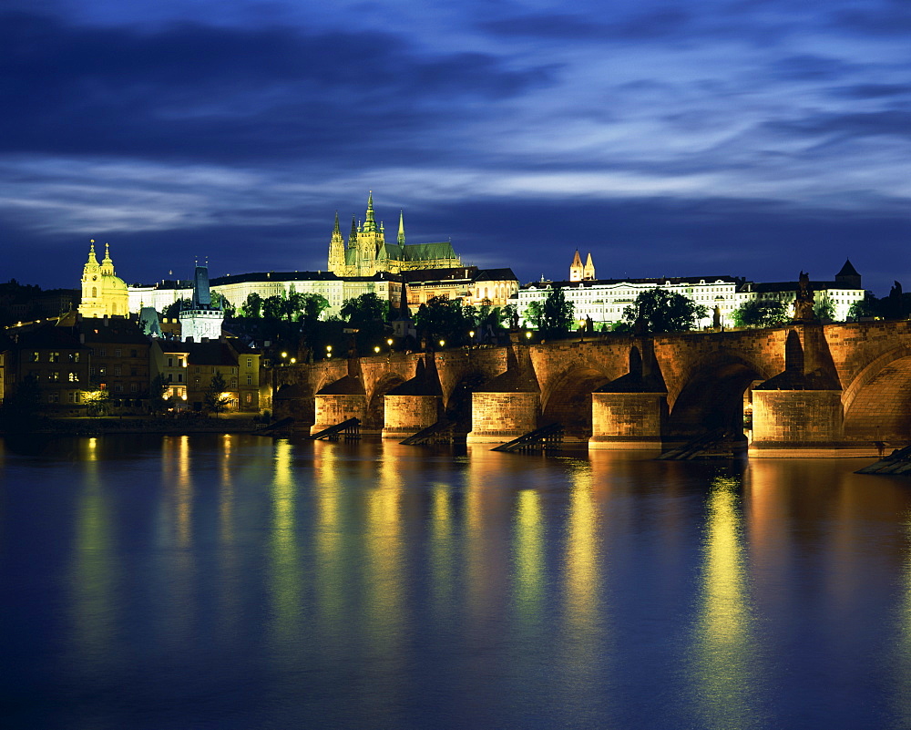 The Vltava River and Charles Bridge with St. Vitus Cathedral and St. Nicholas Church on the skyline of the city of Prague, Czech Republic, Europe