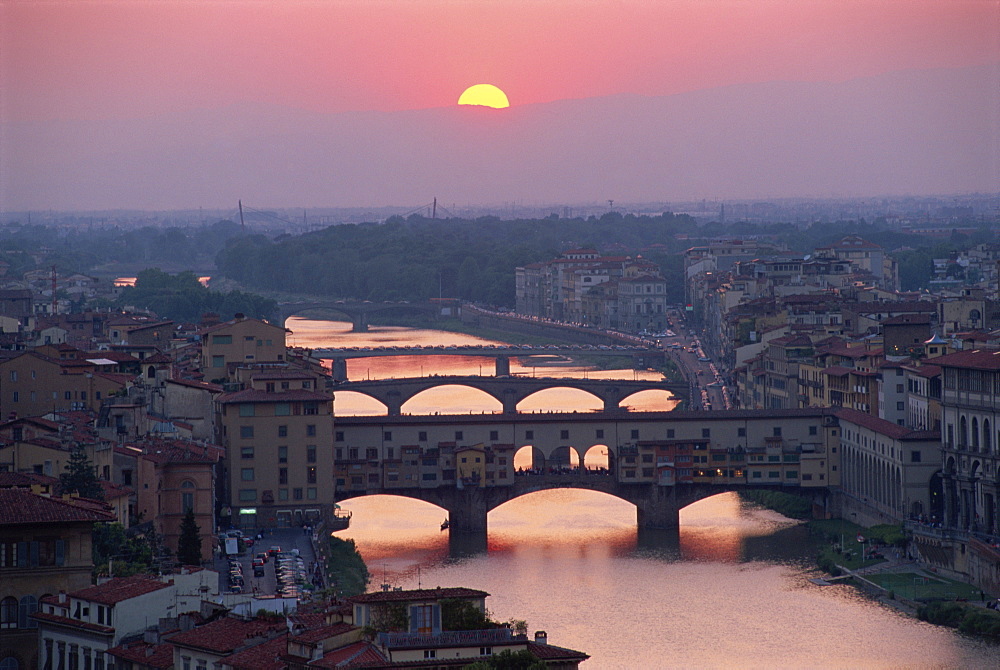 The Ponte Vecchio and other bridges over the River Arno at sunset in the city of Florence, Tuscany, Italy, Europe