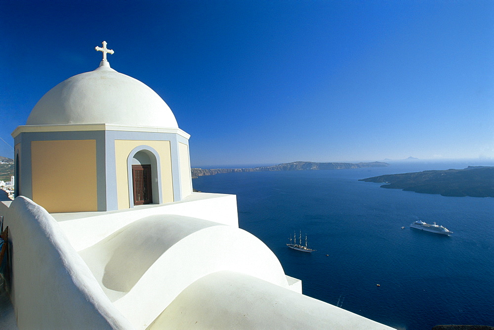 Domed church and view out to sea, Fira, Santorini, Greece 