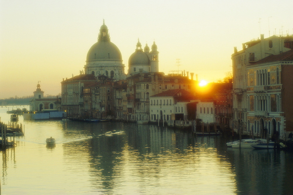 Sunrise behind Santa Maria Della Salute church from Academia Bridge, Venice, Veneto, Italy