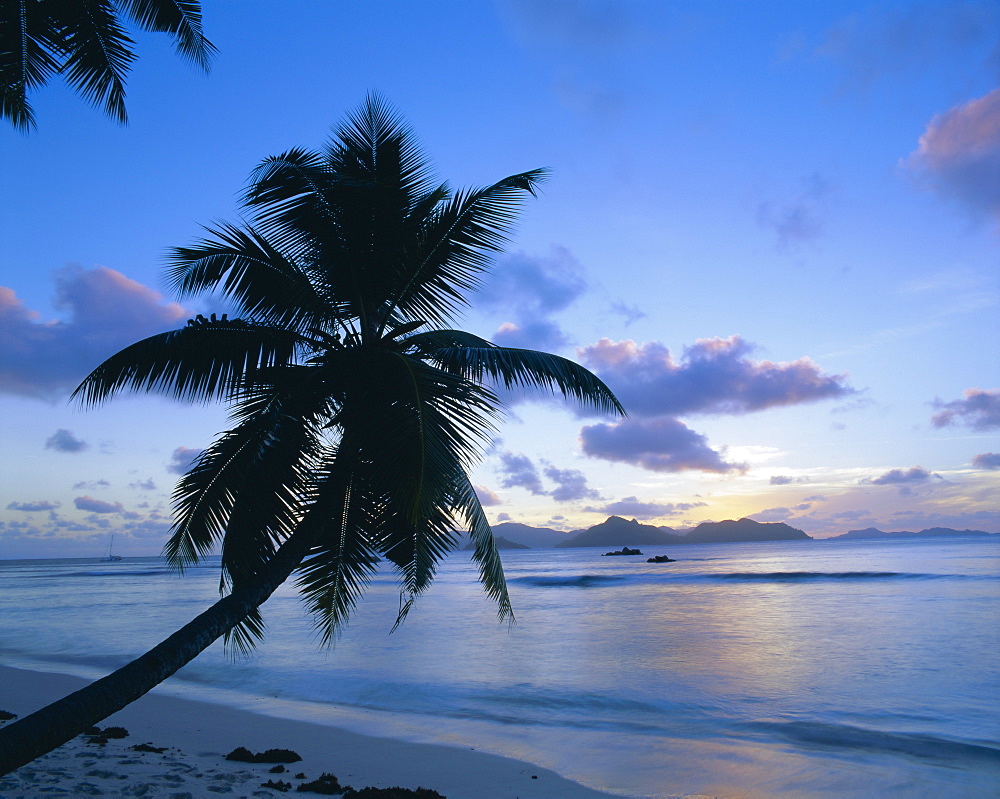 Sunset, Anse Severe, La Digue, Praslin island in the background, Seychelles, Indian Ocean, Africa