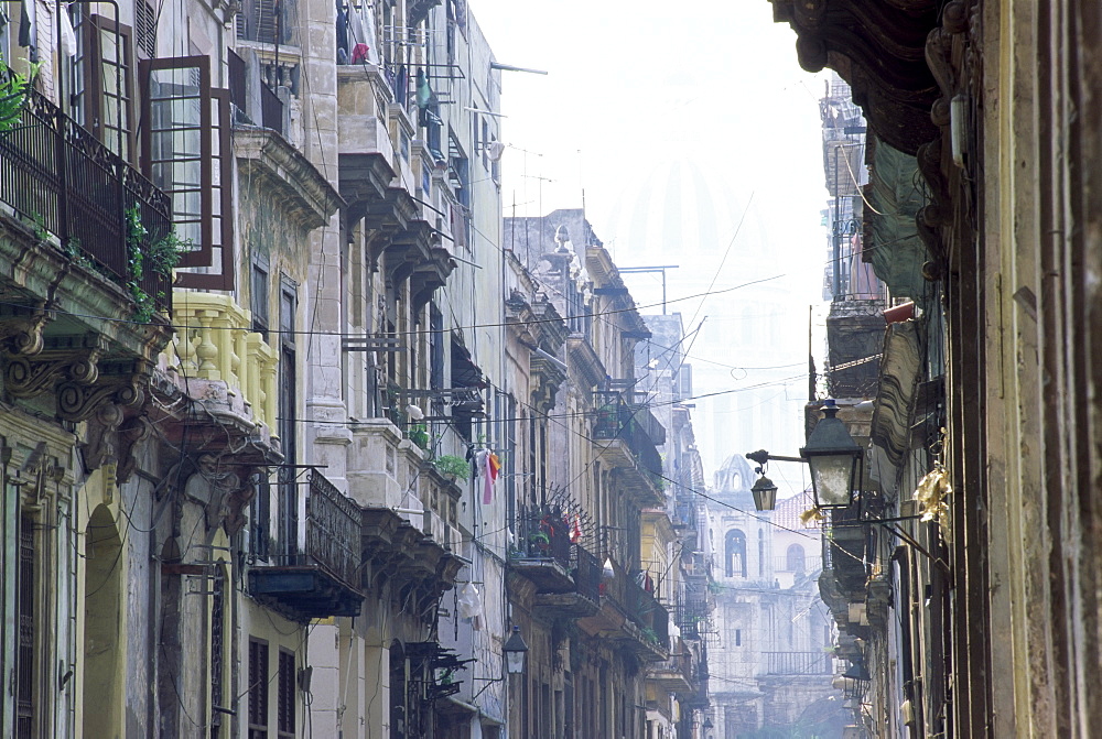 Street scene in Havana Viejo, with Capitolio Nacional in background, Havana (La Habana), Cuba, West Indies, Central America