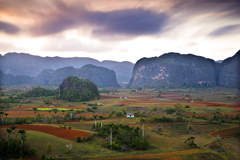 Dusk view across Vinales Valley showing limestone hills known as Mogotes, Vinales, UNESCO World Heritage Site, Cuba, West Indies, Central America