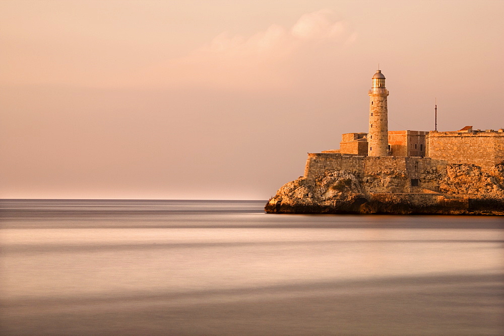 Evening view from The Malecon towards the Castillo de San Salvador de la Punta, Havana, Cuba, West Indies, Central America