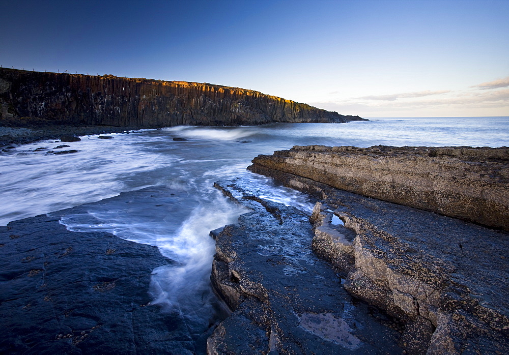 Cullwernose Point bathed in late afternoon light with incoming tide, near Howick, Northumberland, England, United Kingdom, Europe