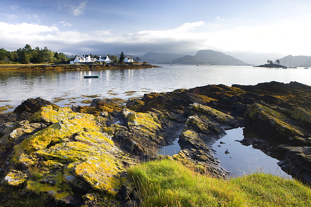 Early morning view of Plokton with houses and foreshore bathed in sunlight, Plokton, near Kyle of Lochalsh, Highland, Scotland, United Kingdom, Europe