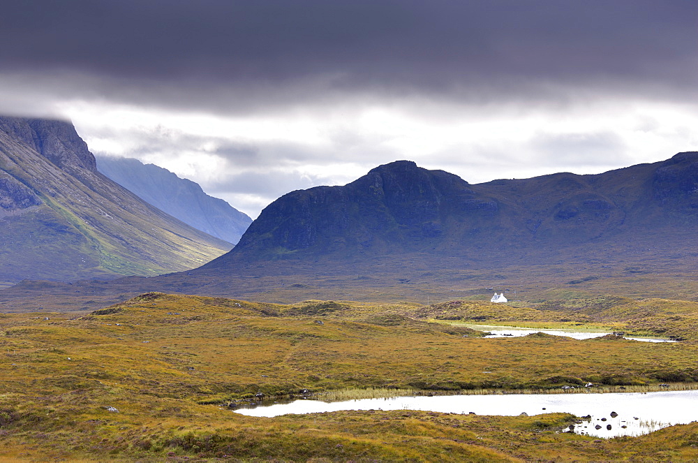 Whitewashed cottage on desolate moorland near Sligachan, Isle of Skye, Highland, Scotland, United Kingdom, Europe