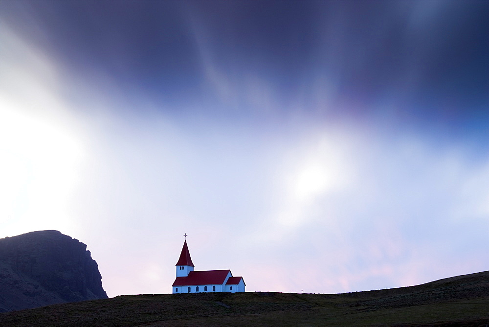 Hilltop church against twilight sky, Vik i Myrdal, southern area, Iceland, Polar Regions