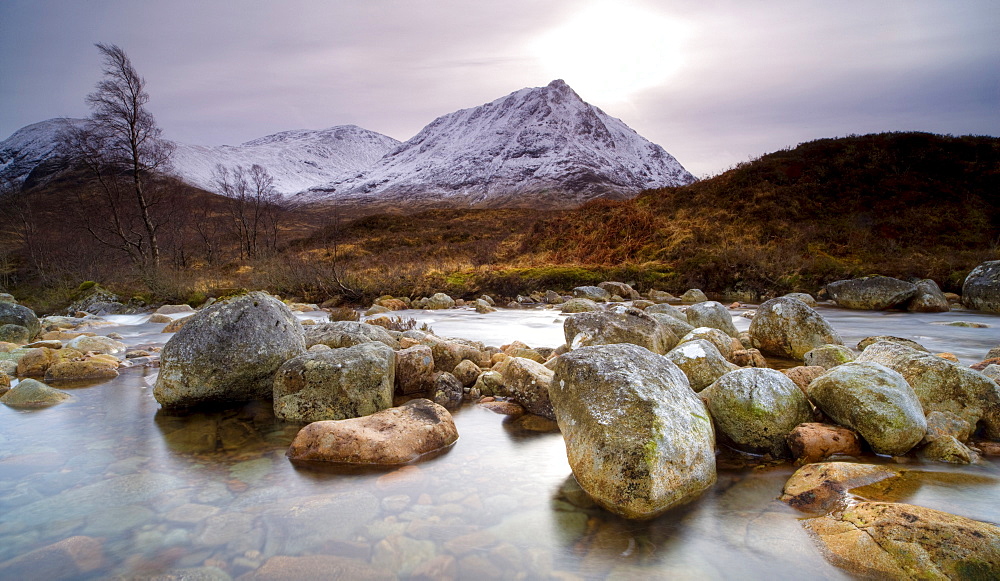 River Coupall, just above the Coupall Falls, looking towards snow-covered mountains, Glen Etive, Highland, Scotland, United Kingdom, Europe