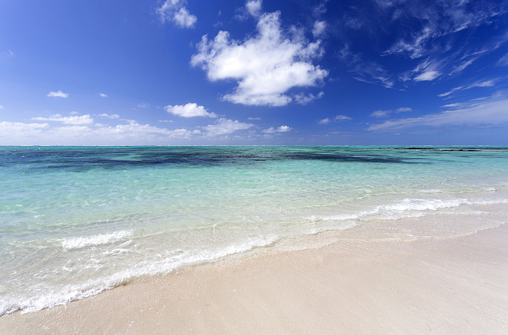 Idyllic beach scene with blue sky, aquamarine sea and soft sand, Ile Aux Cerfs, Mauritius, Indian Ocean, Africa