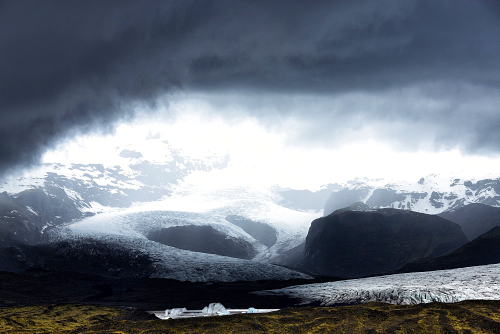 Looking towards Fjallsarlon, a glacial lake fed by Fjallsjokull at the south end of the Vatnajokull icecap. near Jokulsarlon, South Iceland, Iceland, Polar Regions